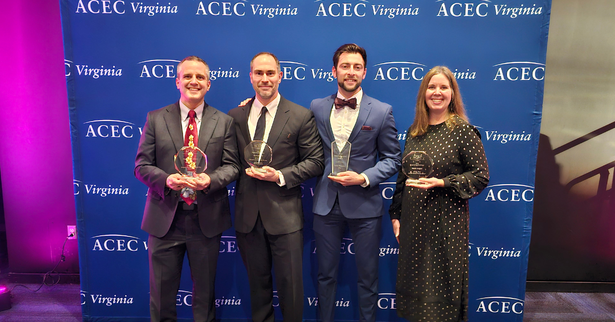 Four people accepting awards