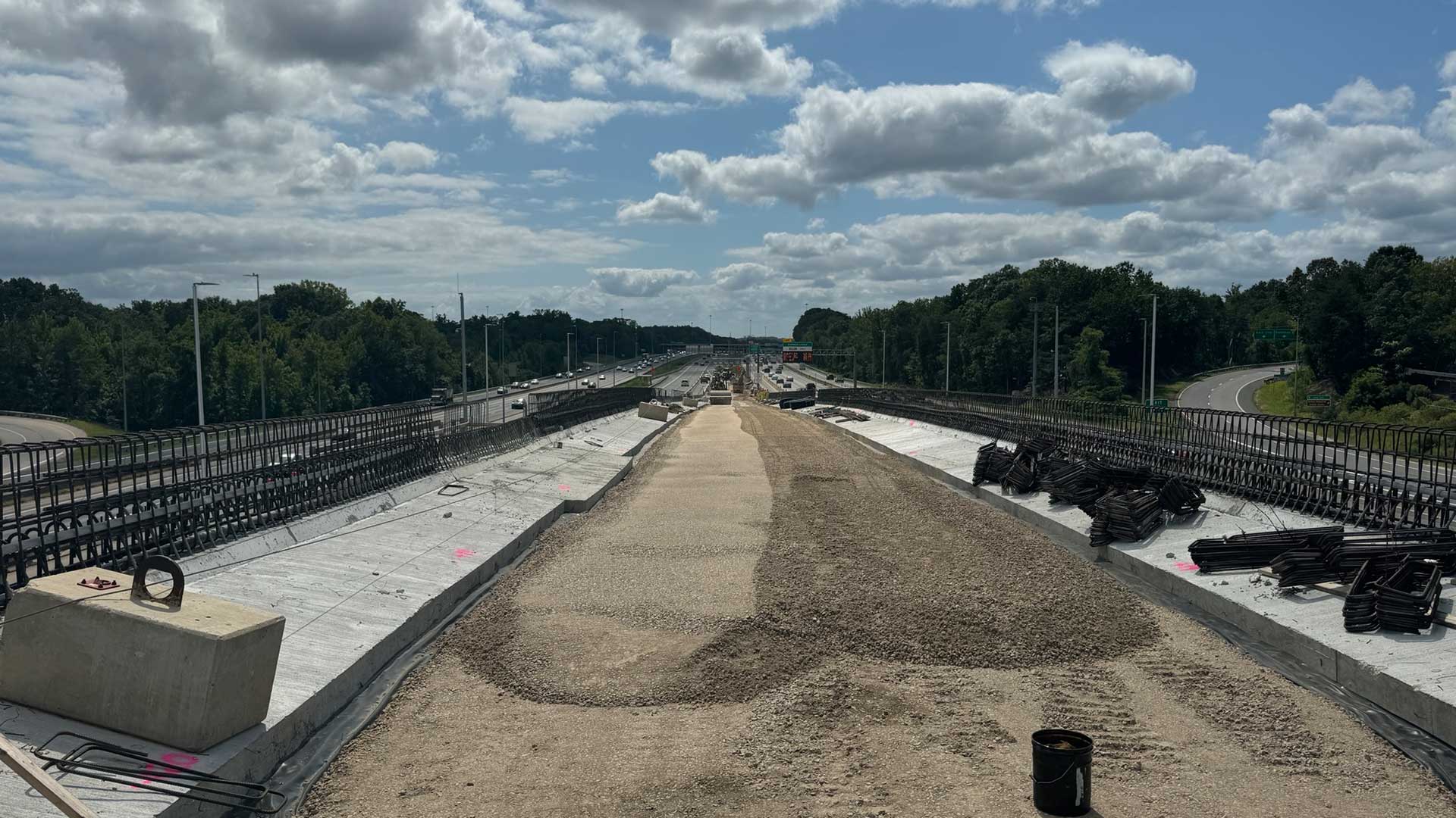 View of a highway under construction, with gravel subbase and road materials