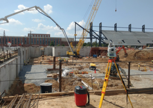 land surveying using Leica total station during construction of Audi Field in Washington, DC