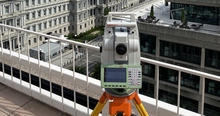 Leica total station on a building rooftop surveying historic Mills Building in Washginton, DC