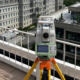 Leica total station on a building rooftop surveying historic Mills Building in Washginton, DC