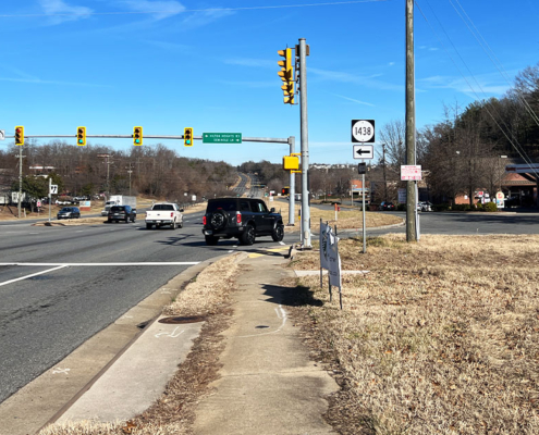 sidewalk in disrepair alongside highway