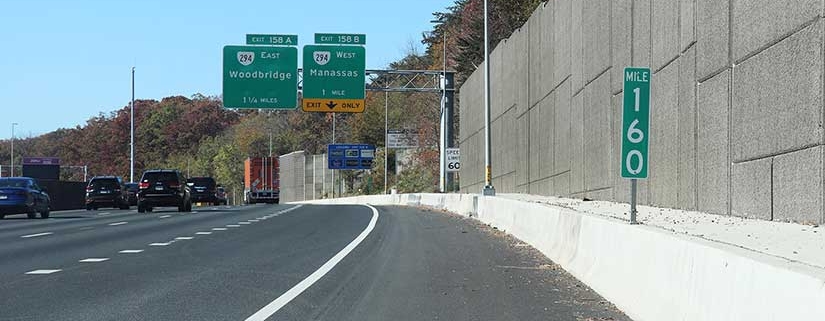 four lane highway with auxiliary lane and noise wall